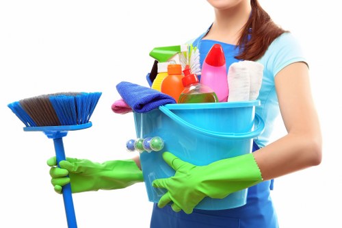 Technician using PPE while cleaning carpets in an N7 property