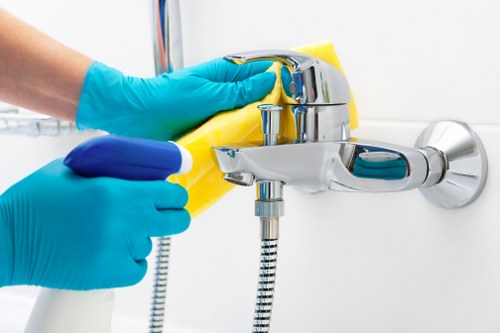 Cleaner maintaining a modern office suite in the N7 area