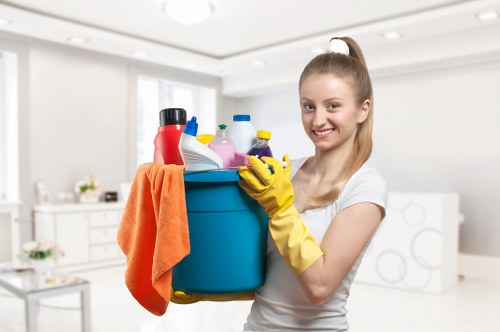 Cleaner working in a kitchen during house cleaning in N7